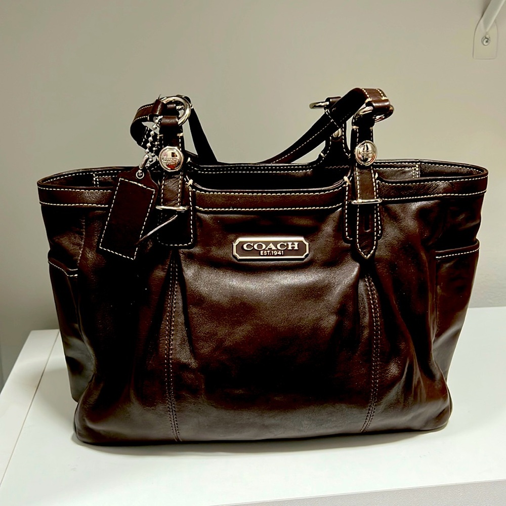 Coach brown leather purse with zipper top and coach tag gently used